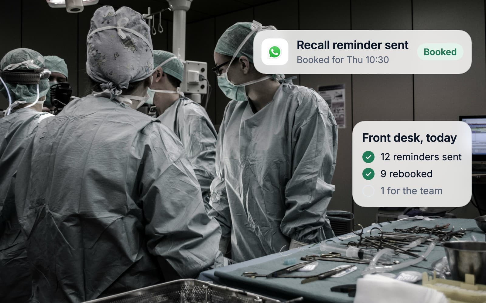 A surgical team at work while patient recalls and bookings run in the background